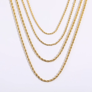 Detail of 18K gold plated stainless steel rope chains showing intricate woven texture