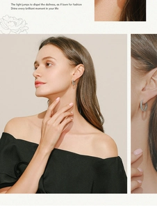 Close-up of elegant S925 silver hoop earrings with turquoise stones on a female model