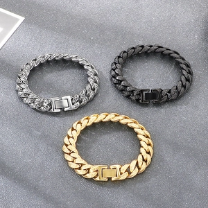Macro detail of punk retro 13mm Cuban chain bracelets in gold, silver, and black finish