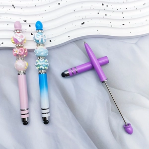 Detail of DIY beaded stylus pens in pink blue and purple gradients with metallic finish