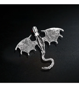 Detailed back view of vintage silver dragon brooch with dual-use pin and pendant loop