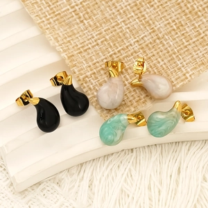 Modern gold-plated stainless steel teardrop earrings in black, white, and green resin