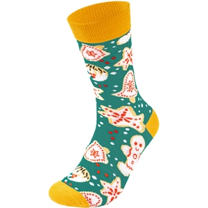 Detail of green Christmas sock featuring gingerbread men, stars and bells patterns