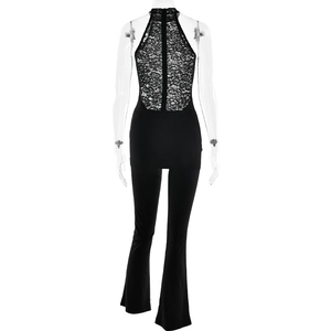 Close-up of the black halter jumpsuit featuring intricate lace patchwork on the open back