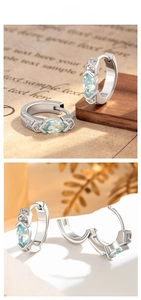 Détail de boucles d'oreilles zircon bleu clair marquise avec fermoir en argent S925