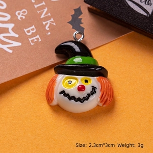 Macro shot of Halloween resin clown pendant with wizard hat and metal ring detail