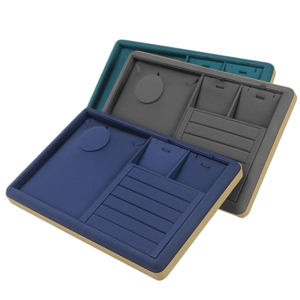Golden PU jewelry display trays in navy, grey, and dark green with velvet lining