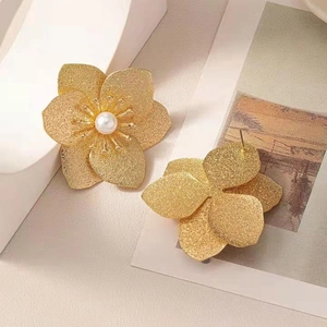 Golden matte flower stud earrings with white pearl center in French vintage style