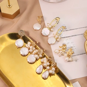 Elegant baroque pearl long drop earrings and floral studs in golden finish and white pearls