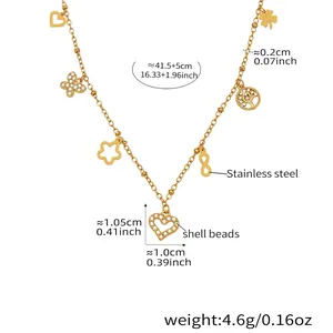 Detail of gold heart necklace with shell beads and star charms in stainless steel