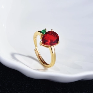 Detail of apple-shaped ring with pear-cut red gemstone and S925 engraving