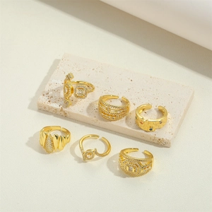 Set of six irregular 14K gold-plated open rings with diverse geometric and stone details