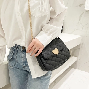 Chic black quilted crossbody bag with golden heart lock and chain strap for women
