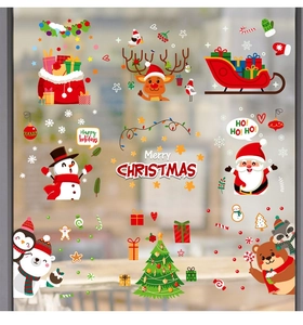 Detailed view of festive Christmas window stickers with Santa, snowman and reindeer motifs