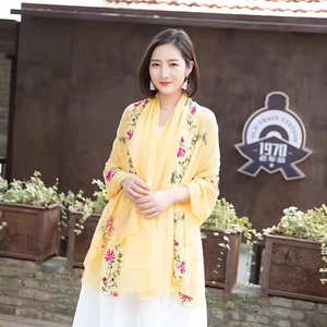 Women's yellow ethnic floral embroidered shawl scarf used as a sun protection beach wrap