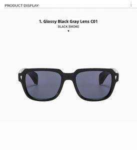 Detail of square black frame sunglasses featuring silver diamond rivets and smoke grey lenses