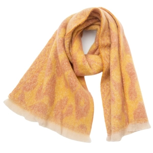 Close-up of leopard print scarf with soft fringe trim and detailed jacquard texture