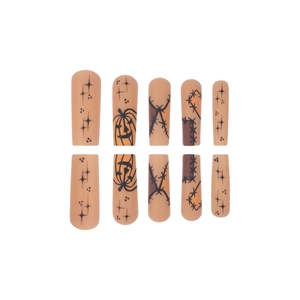 Halloween pumpkin press-on nails with stars and stitch patterns on matte nude base