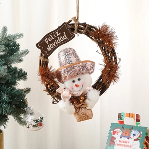 Christmas snowman rattan wreath with glitter accents and Feliz Navidad wooden sign