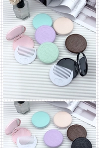 Close-up of portable cookie-shaped makeup mirror and comb set in multiple pastel colors