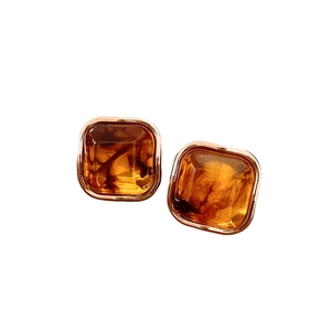 Vintage geometric diamond earrings with amber resin in a polished gold metal frame