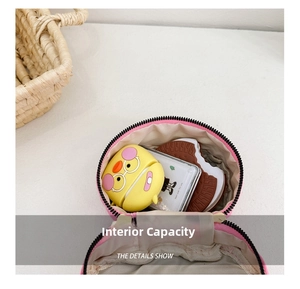 Internal view of pink round storage pouch showing large capacity for cards and power bank