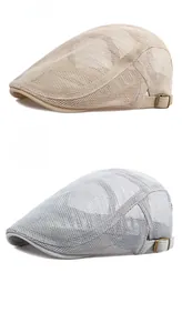 Detail of khaki and light grey mesh beret caps with adjustable side metal buckles