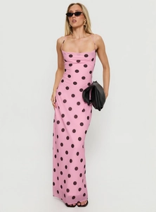 Full view of pink polka dot bodycon cami dress with strappy back and fashion accessories