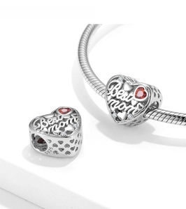 Close-up of S925 sterling silver Best Mom heart charm with red zircon on snake chain