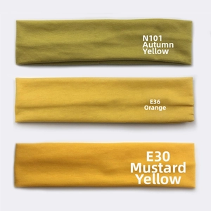 Close-up of three sports headbands in Autumn Fragrance Yellow, Orange, and Turmeric cotton