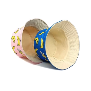 Kids banana print reversible cotton bucket hat in pink and blue for sun protection