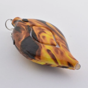 Detail view of leaf-shaped personal alarm with tortoiseshell pattern and LED light