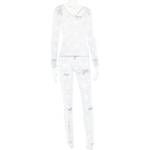 Close-up of white lace bodysuit featuring floral patterns and delicate bow accents