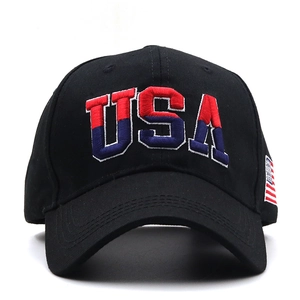 Detail of USA 3D embroidery and American flag patch on a black cotton baseball cap