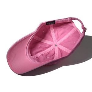Detailed inner view of pink cotton baseball cap with 6-panel stitching and metal buckle