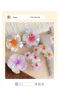Detail of gradient flower hair claw clips in various sizes with pearlescent finish
