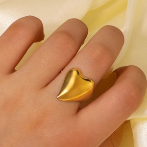 Minimalist gold heart shaped adjustable open ring for women worn on finger