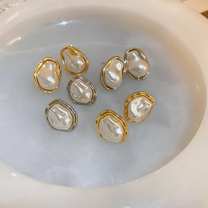 Baroque irregular faux pearl earrings set with gold and silver metallic frames