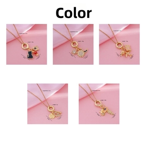 Detail view of five 18K gold plated necklaces featuring cat and celestial pendants