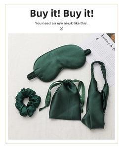 Flat lay of dark green satin sleep set including eye mask, scrunchies and drawstring bag
