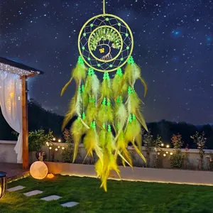 Luminous dream catcher with green tree of life and feathers for home wall decor