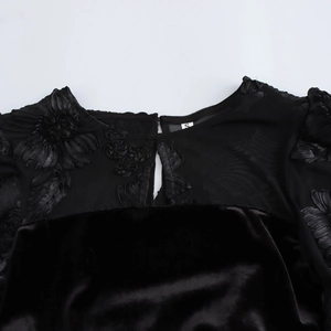 Elegant black velvet evening gown with floral embroidery and mesh back detail