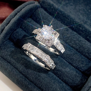 Macro view of silver color engagement ring set with cubic zirconia in blue velvet box