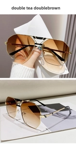 Details einer Piloten-Sonnenbrille mit braunem Farbverlauf und hohlem Goldrahmen