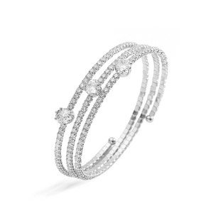Macro detail of silver layered open bracelet with pavé cubic zirconia and round stones