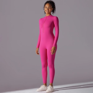 Detail shot of the front zipper and collar on this rose pink long sleeve yoga bodysuit