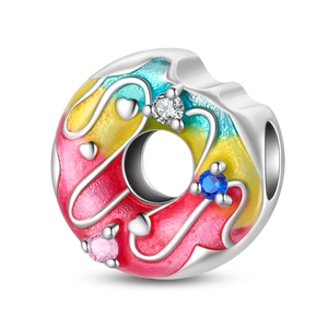 Macro shot of silver donut charm with pink yellow gradient enamel and colorful zircons
