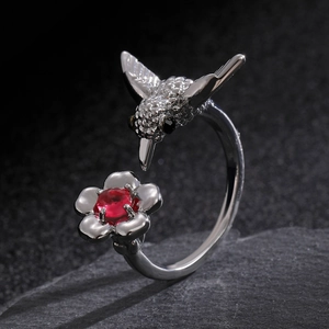 Retro hummingbird and floral silver-tone open ring with red gemstone accent