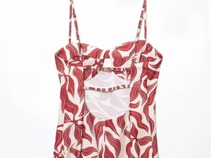 Detailed back view of linen-blend midi dress with floral print and cutout design