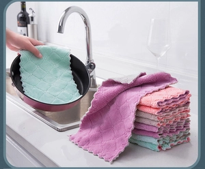 Thickened absorbent cleaning cloth with diamond texture in a kitchen setting